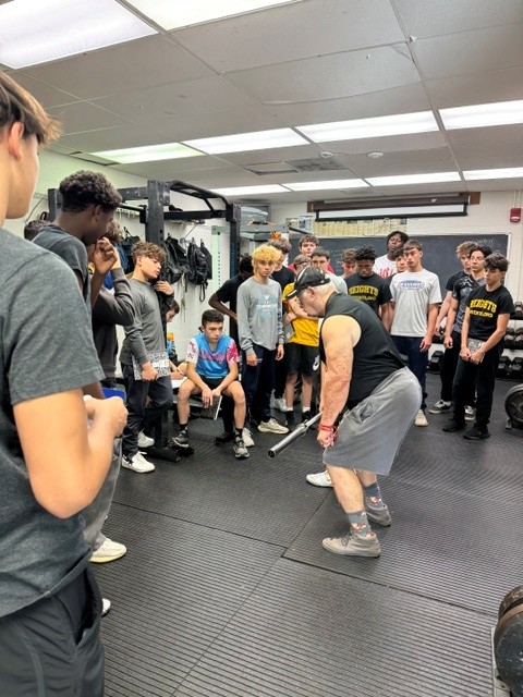 Demonstrating form in the weight room